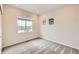 Cozy bedroom with neutral walls, plush carpet, and ample natural light at 8822 Fraser River Loop, Littleton, CO 80125