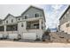Attractive townhome with stone accents, balcony, and two-car garage at 8822 Fraser River Loop, Littleton, CO 80125