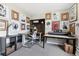 Bonus room with versatile space, natural light, and multiple workspaces for various activities at 11390 Shimley Rd, Golden, CO 80403