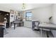 Bonus room with versatile space, natural light, and multiple workspaces for various activities at 11390 Shimley Rd, Golden, CO 80403
