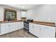 Charming kitchen featuring butcher block countertops, stainless steel oven and white cabinets at 11390 Shimley Rd, Golden, CO 80403