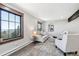 Inviting living room with large windows offering stunning mountain vistas at 11390 Shimley Rd, Golden, CO 80403
