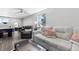Bright and airy living room with comfortable sofas and an air hockey table in the background at 11390 Shimley Rd, Golden, CO 80403