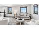 Bright living room featuring a comfortable sofa and picturesque window views at 11390 Shimley Rd, Golden, CO 80403