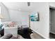 Cozy living room area featuring neutral walls, comfortable sectional sofa, and large TV at 11390 Shimley Rd, Golden, CO 80403