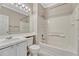 Bright bathroom features a bathtub-shower, vanity, and ample lighting at 2741 Poplar Grove Pl, Castle Rock, CO 80109
