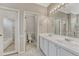 Bright bathroom featuring a double vanity, tile flooring, and separate toilet and shower areas at 2741 Poplar Grove Pl, Castle Rock, CO 80109