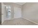 Cozy bedroom with access to the hallway and a closet, carpeted for comfort at 2741 Poplar Grove Pl, Castle Rock, CO 80109