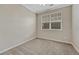 Neutral bedroom featuring a window with blinds and plush carpeting at 2741 Poplar Grove Pl, Castle Rock, CO 80109