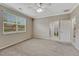Comfortable bedroom with a ceiling fan, ample natural light, and plush carpeting at 2741 Poplar Grove Pl, Castle Rock, CO 80109