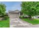 Charming home featuring a well-manicured front yard, a two-car garage, and a cozy front porch at 2741 Poplar Grove Pl, Castle Rock, CO 80109