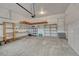 Spacious garage featuring ample storage, shelving, and a well-lit interior at 2741 Poplar Grove Pl, Castle Rock, CO 80109