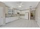 Bright kitchen featuring white cabinets, tiled backsplash, granite countertops, and stainless steel appliances at 2741 Poplar Grove Pl, Castle Rock, CO 80109