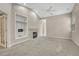Open living room with vaulted ceiling, modern fireplace, and neutral carpet at 2741 Poplar Grove Pl, Castle Rock, CO 80109