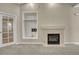 Bright living room showcasing a modern fireplace with tile surround and built-in shelving at 2741 Poplar Grove Pl, Castle Rock, CO 80109