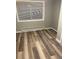 Cozy bedroom featuring a window and updated flooring at 2815 S Dexter Way, Denver, CO 80222