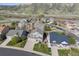 Residential neighborhood aerial view featuring lush greenery, mature trees, and well-kept homes at 3978 Aspen Hollow Ct, Castle Rock, CO 80104