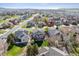 Aerial view of homes in a residential area with well-maintained lawns and landscaping at 3978 Aspen Hollow Ct, Castle Rock, CO 80104
