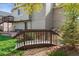 Landscaped backyard featuring a foot bridge leading to a patio at 3978 Aspen Hollow Ct, Castle Rock, CO 80104