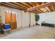 Open unfinished basement space with utilities, storage, an egress window with curtains, and exposed ceiling at 3978 Aspen Hollow Ct, Castle Rock, CO 80104
