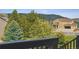 Charming exterior view of a yellow two-story home with a well-manicured lawn and mature trees, captured on a sunny day at 3978 Aspen Hollow Ct, Castle Rock, CO 80104