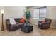 Inviting living room with a comfortable sofa, accent chair, and natural light from a window at 3978 Aspen Hollow Ct, Castle Rock, CO 80104