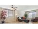 Bright living room with large windows, wood floors, and cozy seating at 3978 Aspen Hollow Ct, Castle Rock, CO 80104