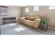 Neutral carpeted living room with a sofa, natural light and minimal decoration at 3978 Aspen Hollow Ct, Castle Rock, CO 80104