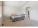 Carpeted bedroom with an ensuite bathroom and walk-in closet at 3978 Aspen Hollow Ct, Castle Rock, CO 80104