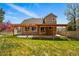 Beautiful backyard with green lawn, pergola, and outdoor living space perfect for relaxation and entertaining at 19061 E Powers Pl, Aurora, CO 80015