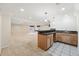 Basement entertainment area with bar, sink, and modern pendant lighting at 19061 E Powers Pl, Aurora, CO 80015