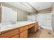 Bathroom featuring double vanity with tub-shower combo and tile floors at 19061 E Powers Pl, Aurora, CO 80015