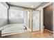 This primary bathroom features a soaking tub and glass shower at 19061 E Powers Pl, Aurora, CO 80015