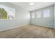 Bedroom featuring three windows for natural light at 19061 E Powers Pl, Aurora, CO 80015