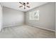 Empty bedroom with neutral carpet and window at 19061 E Powers Pl, Aurora, CO 80015