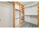 Walk in closet with custom built in shelves at 19061 E Powers Pl, Aurora, CO 80015