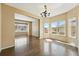 Elegant dining room with hardwood floors, chandelier and windows at 19061 E Powers Pl, Aurora, CO 80015