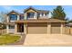 Charming two-story home with a three-car garage and well-maintained landscaping at 19061 E Powers Pl, Aurora, CO 80015