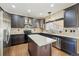 Kitchen features granite countertops, dark wood cabinets, stainless steel appliances, and hardwood floors at 19061 E Powers Pl, Aurora, CO 80015