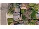 Aerial view of a property featuring a well-manicured yard, patio, and a neatly arranged roof at 12155 W 68Th Pl, Arvada, CO 80004