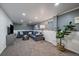 Finished basement with cozy gray sectional, plush carpet, and recessed lighting, perfect for entertaining at 12155 W 68Th Pl, Arvada, CO 80004