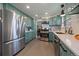 Modern kitchen featuring stainless steel appliances, sleek countertops, and ample storage space at 12155 W 68Th Pl, Arvada, CO 80004