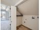 Attic space with unfinished closet and laundry hookups at 2572 Chase St, Edgewater, CO 80214