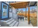 Cozy back patio with stylish outdoor seating, perfect for relaxing or entertaining guests at 2572 Chase St, Edgewater, CO 80214