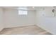 Unfinished basement space with painted walls, concrete floor, and a small window at 2572 Chase St, Edgewater, CO 80214