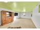 Basement featuring vintage cabinet with TV and carpeted floors at 5442 S Cedar St, Littleton, CO 80120