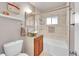 Stylish bathroom featuring a vessel sink, tiled shower/tub combination, and modern fixtures at 5442 S Cedar St, Littleton, CO 80120