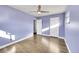 Bedroom featuring hard wood floors, natural light, and multiple closets for ample storage at 5442 S Cedar St, Littleton, CO 80120