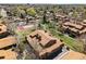 Charming community aerial view featuring mature trees, townhomes, and a tennis court at 540 S Forest St # 5-204, Denver, CO 80246