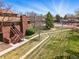 Aerial view of apartment complex and tennis court in neighborhood at 540 S Forest St # 5-204, Denver, CO 80246